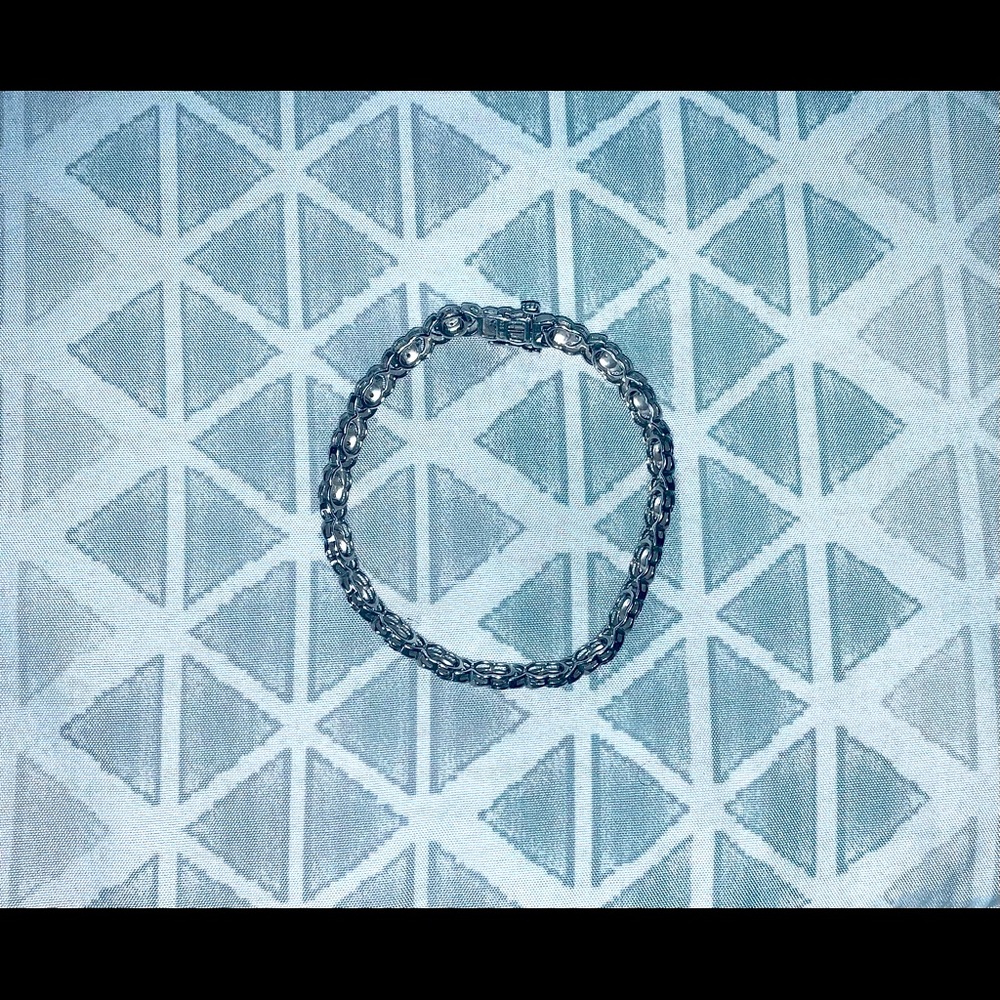 Sterling silver tennis bracelet.